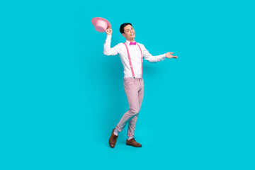 Full body photo of handsome guy wear white shirt pink bow tie take off headwear on valentine day...