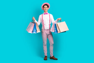 Full body photo of satisfied nice guy wear white shirt pink headwear bow tie holding shopping bags...