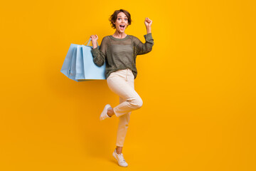 Photo of cheerful glad girl wear stylish clothes celebrate seasonal low price offer empty space...