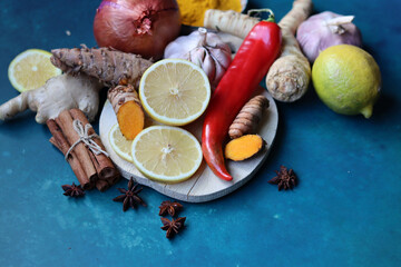 Immune system booster ingredients top view photo.  Spices and herbs on a blue background with space...