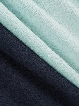 example of bath towels. mint and navy blue black. example of color and pile, macro details