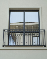 New window  with black wrought iron window railings closeup