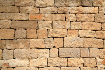 yellow sandstone brick wall