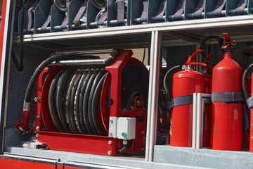 Close-up of essential firefighting equipment on a modern firetruck, showcasing tools and gear ready for emergency response to hazardous fire situations