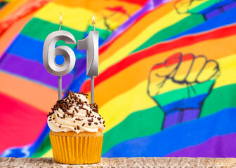 Birthday candle number 61 - Gay march flag background
