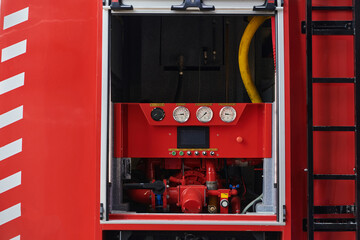 Close-up of essential firefighting equipment on a modern firetruck, showcasing tools and gear ready...