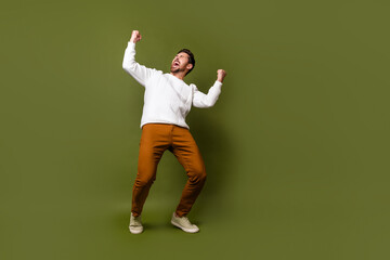 Photo of cheerful positive glad nice man wear trendy white clothes shouting yeah empty space...
