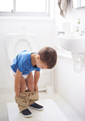 Child, bathroom and toilet training in diaper or learning growth, milestone or hygiene. Male...