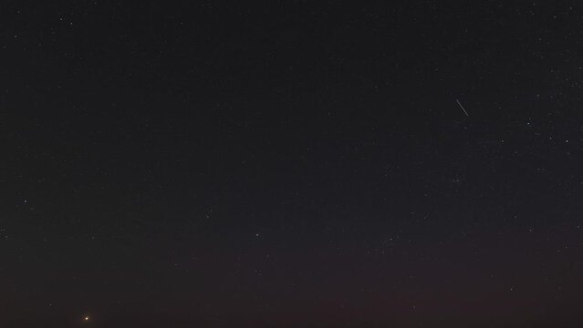 Timelapse of the starry night sky with very subtle northern lights. fullscreen 4k rotating night sky time lapse. astronomy backdrop.