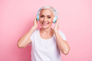 Photo portrait of pretty retired female touch headphones listen music wear trendy white outfit...