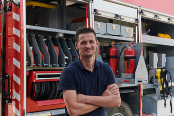 Confident firefighter stands with crossed arms, exuding resilience and preparedness, ready to...