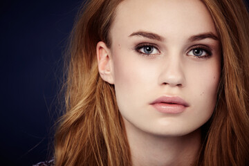 Fototapeta premium Woman, cosmetics and hair in studio portrait, keratin treatment and pride for results by black background. Female model person, beauty and aesthetic makeup, face and hairstyle care or confidence