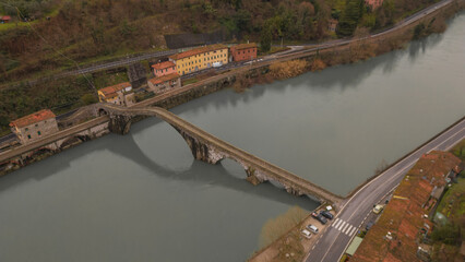 Devil's Bridge, Tuscany. Lucca. Suspension bridge over mirror water.
