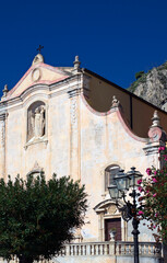 Detailed view of medieval San Giuseppe Church on Piazza IX Aprile square in the downtown of Taormina, Sicily. Architectural icon of the city of Taormina. Travel and tourism concept