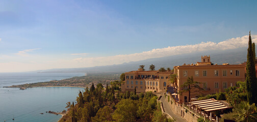 Panoramic nature landscape view of Taormina. Scenic coastline seen from Taormina. Famous touristic place and romantic travel destination in Sicily, Italy