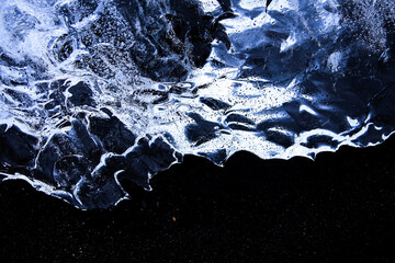 stranded glacier ice blocks at Diamond beach in Iceland 