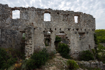 Fototapeta na wymiar Ruins of ancient Monastery of Saint Marry of the Angels on the coast of medieval town Osor situated between the islands of Cres and Mali Losinj