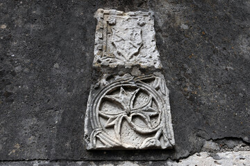 Ancient Stone Carving Ornaments and Symbols on a Town Streets Walls - Osor, Croatia