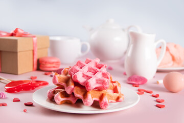 Homemade pink waffles with whipped cream. Valentine's day, Mother day concept. Tasty breakfast.
