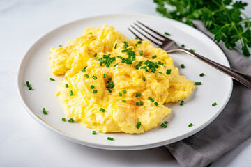 Scrambled Eggs on White Plate With Fork