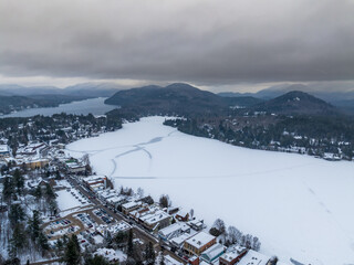 Afternoon winter aerial photo of Mirror Lake in the Village of Lake Placid, New York. (01-05-2024)