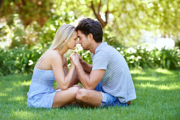 Couple, forehead touch and relax in park with love and commitment in healthy relationship. People on a date outdoor, peace and mindfulness with trust, partner and bonding together for marriage