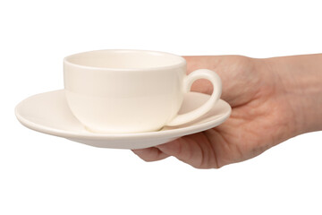 Female hand holding coffee cup and saucer isolated on white background.