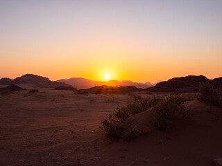 Fototapeta na wymiar Journeys in the Wadi Rum desert in Jordan, between mountains and camels