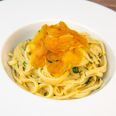LINGUINE PASTA RECIPE WITH POUTARGUE, LEMON, GARLIC, LEMON ZEST, FRESH CREAM AND PARSLEY. High quality photo