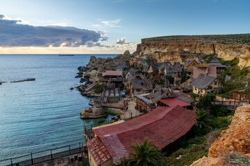view of idyllic Anchor Bay and Popeye Village amusement park in Malta