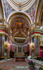 Fototapeta na wymiar view of the central nave and altar in the Metropolitan Cathedral of St. Paul in Mdina