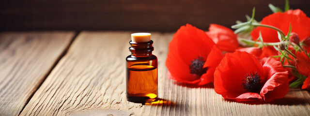 essential oil extract from red poppy flowers on a wooden table - obrazy, fototapety, plakaty