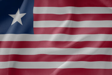 Obraz premium Liberia waving flag close up fabric texture background