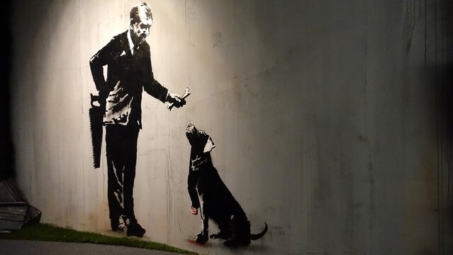 Stockholm, Sweden, December 29 2023. Art exhibition. The mystery of Banksy A genius mind. The man and the dog.