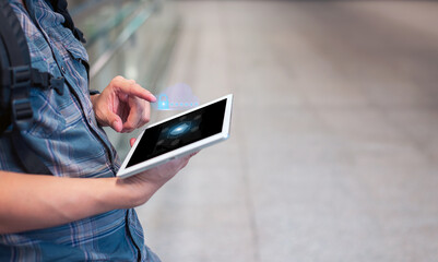A businessman utilizing a futuristic tablet computer is seen in a side perspective, integrating a...