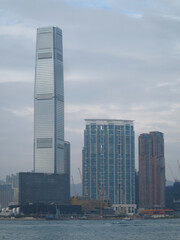 Naklejka premium Hong Kong, China - December 22 2023: Skylines of West Kowloon, Hong Kong. Including ICC, M+, West Kowloon Station.