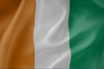 Côte d'Ivoire  waving flag close up fabric texture background