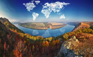 Printed kitchen splashbacks Grey 2 clouds in the form of a world map over the river canyon. Travel and landscape concept. autumn morning