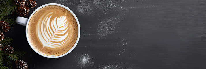 Cup of coffee with latte art, top view. Winter cozy background with copy space. Hot drink with fir branches on background.
