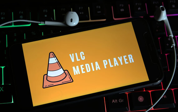Viersen, Germany - January 9. 2024: Closeup of smartphone on pc keyboard with logo lettering of VLC media player