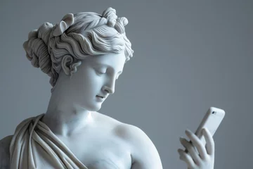 Deurstickers Ancient Greek goddess sculpture holding a smartphone. Female marble statue scrolling social media. Doomscrolling, mental health, digital wellness, time loss concept. Bad habits, reading news. © Magryt