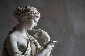 Fotobehang Ancient Greek goddess sculpture holding a smartphone. Female marble statue scrolling social media. Doomscrolling, mental health, digital wellness, time loss concept. Bad habits, reading news. © Magryt