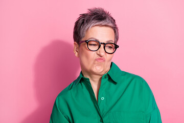 Photo portrait of lovely senior lady look disgusted wry face empty space wear trendy green garment...
