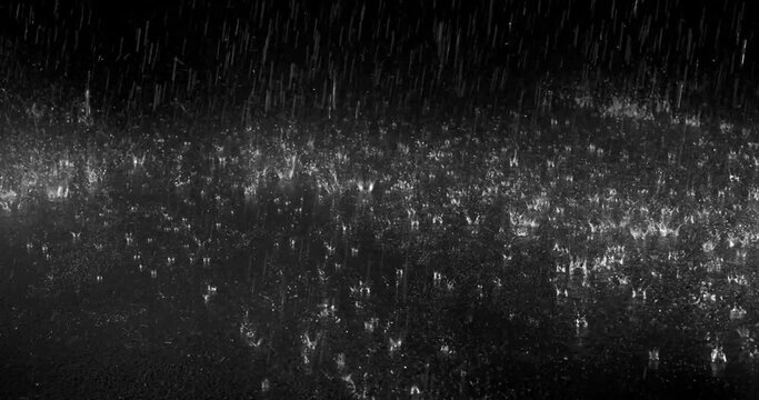 Rain on Ground High Angle 8 3770 2KRainy night. Close up of rain falling and many droplets