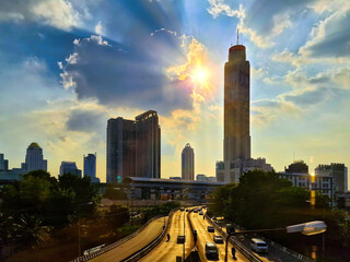 View of Bangkok, the impressive structure of highways, the Sun is seen beautifully from behind the...