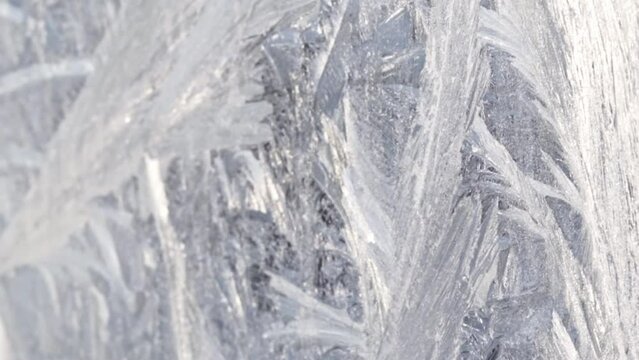 Close up, slow motion footage of the frosted window. Season