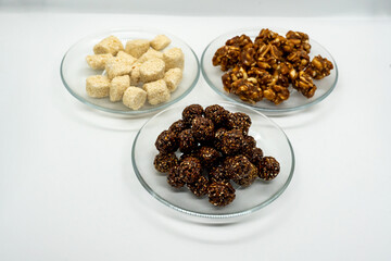 Three Plates Full of Sesame Ladoo, Til ko Laddu, Jaggery Peanuts Laddoo for Maghe Sankranti and Makar Sankranti Festival in Nepal and India