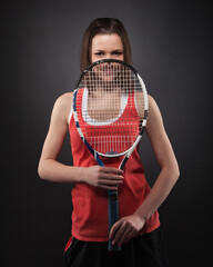 Portrait of sporty girl tennis player with racket
