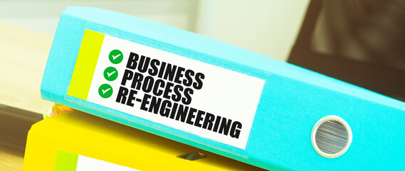 Two office folders with text BUSINESS PROCESS RE ENGINEEERING