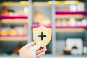 Shield protect symbol with healthcare medical icon. Security protection and health insurance.	